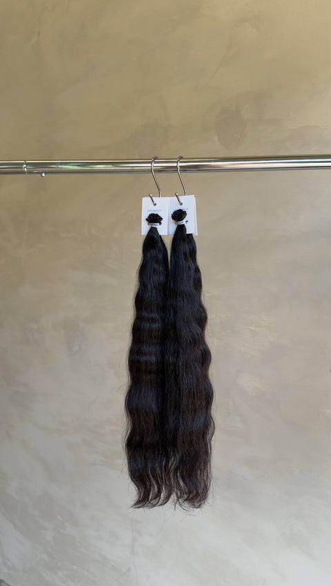 Rich brunette wavy Slavic hair extensions, expertly blended for a seamless, natural finish in North Lakes, North Brisbane