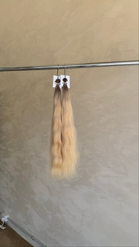  hair extensions with a blonde ombre gradient 